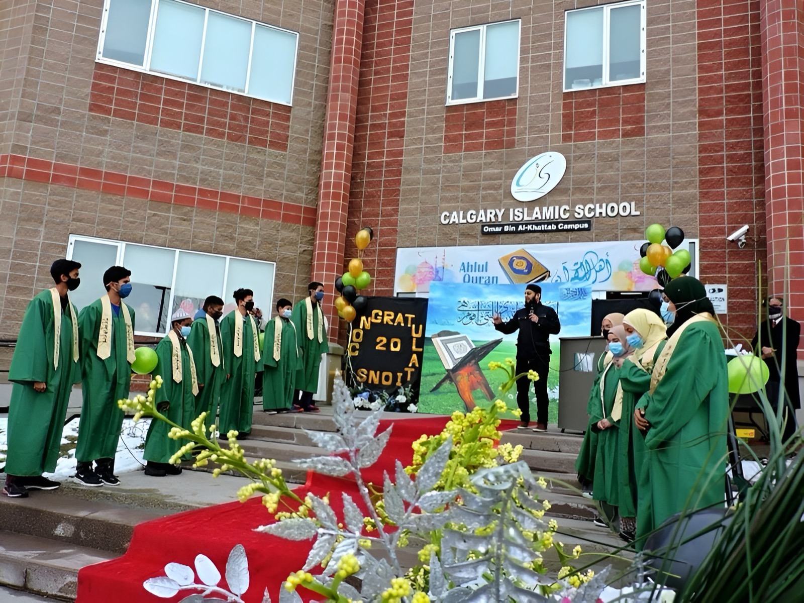 OBK Tahfeeth graduates celebrating outside Calgary Islamic School